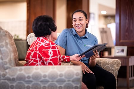 Associate showing resident Ipad