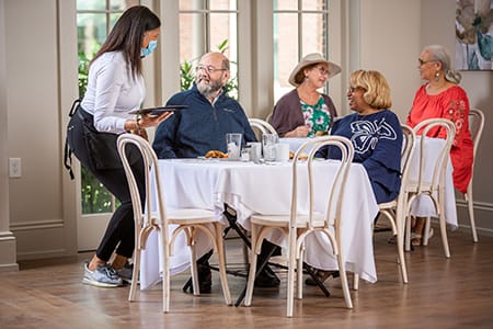 Server taking a couple's order